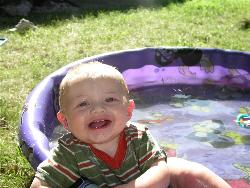 My Handsome little man! - My cute Little guy having fun in his little pool...he loves the water.