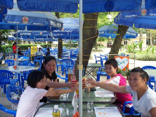 A Joyous Celebration - These are my Chinese students I took on a feild trip. .They never have eaten Western food so I took them to a nice little outdoor cafe.It was their first time eating in a patio.  Each oredered a differant meal. When the meal came they all shared with each other.That way they got to try may differant dishes. They liked it very much. The lady is one of the students momma's who came along as a chaperone. She liked it a lot as well