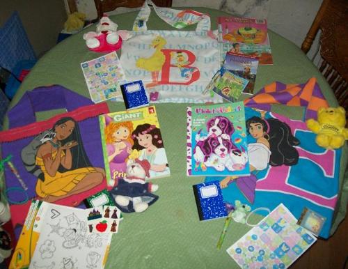 Birthday Bags for my Granddaughters - I made the bags using part of a sheet, and the others out of pillow cases. All bought for just .25 each at yard sales. Most the items in the photo to go in the bags I won with my points on listia.com. In total I only spent $2.10 cash for 3 birthday gifts. Birthday Bags for my Granddaughters - I made the bags using part of a sheet, and the others out of pillow cases. All bought for just .25 each at yard sales. Most the items in the photo to go in the bags I won with my points on listia.com. In total I only spent $2.10 cash for 3 birthday gifts.