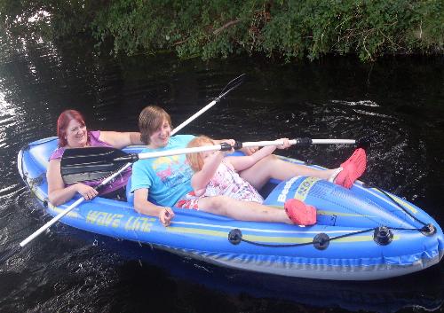 A trip on the canal - My daughter, son and granddaughter rowing along the Lancaster Canal