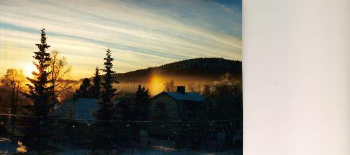 Winter Rainbow - The sun was low in middle of the winter. It was shining on some kind of fog and there it is, rainbow colors below the hill.