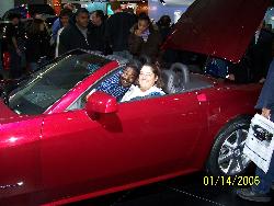 Photos Gone Wrong !!! - This photo was taken that the Detroit Auto Show in 2006.  My husband took this photo while I was sitting in the driver's seat of this car.  Just prior to taking the photo, a gentleman climbed in the vehicle and when when my husband clicked the camera, this is what he did.