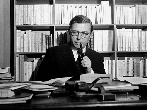 Jean Paul Sartre - The person being portrayed in the photo is Jean Paul Sartre in his own library. He endures laborious writing especially in his philosophical works.