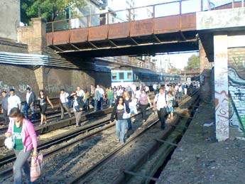 Sarmiento train, Argentina - A train in fire, and all passagers running on the rails to escape from it. A situation not so uncommon here.
