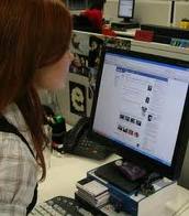 Facebook User - This is a photo of a girl using Facebook! She is very closed to Facebook. She finds enjoyment using it! Chatting with friends, and playing Facebook games like Farmville!