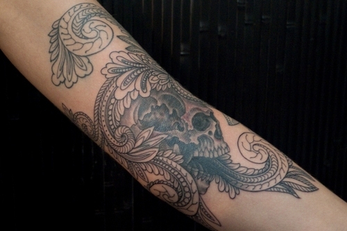 skull filigree - A skull tattoo with decorative filigree-ish designs