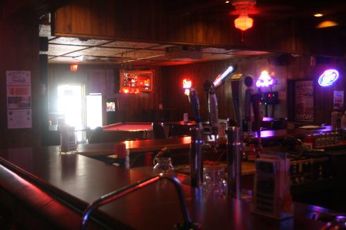 bar setting - the inside of a bar, with glowing neon lights