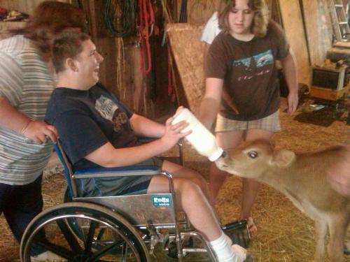 Son feeding calf - So scared, but brave. Son feeding calf - So scared, but brave.