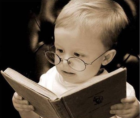 cute baby reading a book. - this picture was sent to me by my uncle ,there are several pictures of cute babies. but this one caught my attention.it really amazes me to see persons or in this case,a baby reading a book.i love reading books my self, so this one goes to the top of my list of pictures....
