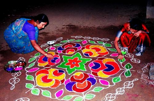 Rangoli - Women puting Rangoli