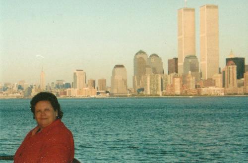 My wife with NY City Skyline in the background - My wife posing in a New Jersy park on a cold day with the New York City Skyline including the Twin Towers of the World Trade Center in 1992.