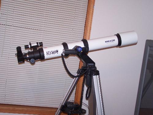 My telescope - I love to sit on our deck and gaze at the stars with it.