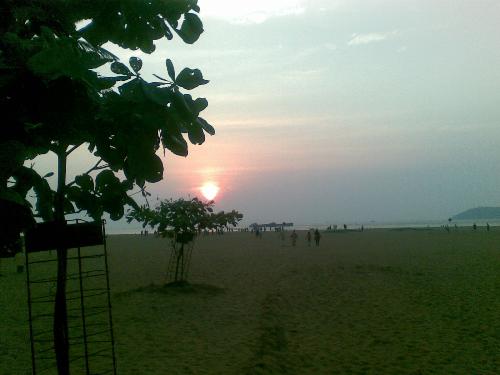 Sunset At Mirabar Beach - Miramar beach is located near Panaji city, capital of Goa, India. Torists throng this beach round the year. The picturesque surroundings here give the beautiful view of the sunset. Since the photo is taken with mobile phone the quality is not that good. However I hope you will enjoy it.