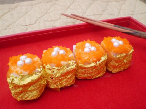 World's Most Expensive Sushi (Onli in Da Pilipins) - Made by Filipino Chef Angelito Araneta Jr., this sushi roll is considered THE WORLD's MOST EXPENSIVE SUSHI. it is consisted of 70 Yrs Old Virgin Water, 12 Yr Old Italian Balsamic Vinegar, Moscuvado Suger, Norwegian Pink Salmon, Caviar, Foie Gras, Sea Cucumber (smoked and pickled and steamed until sicky tender) and mango. Garnished with 4 african diamonds, 12 palawan pearls and coated with 24k edible gold, this four pieces sushi is priced at nearly Php200,000.00 per four pieces (Appros 4,300USD)