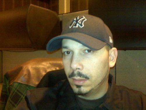 Me at work, wishing I was home. - Me sitting at my desk.