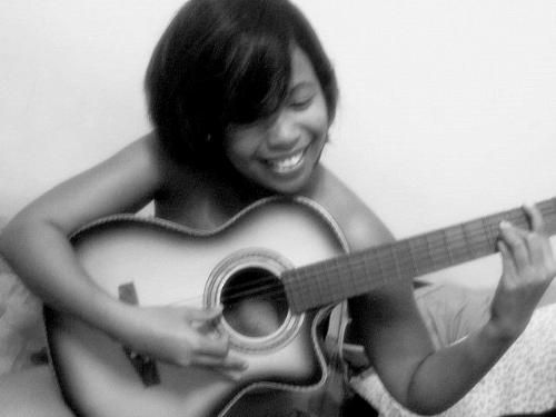 Playing my guitar - My guitar is my most precious possession. I express myself through and with it.