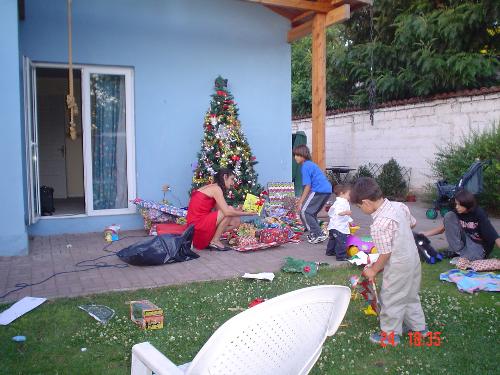 Chistmas in Summer - Grandchildren play while presents and handed down.