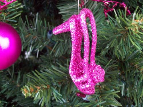 Last year's tree - Here is a picture of last year's 'femmed up' Christmas tree. I have 2 sons and a husband....so I needed something feminine. Add hot pink bllls, a pink purse and silver balls and it was beautiful.