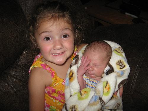 Welcoming the new baby - She is soooo happy NOT to be 'the baby' anymore. LOL