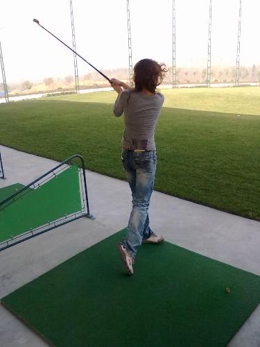 playing golf  - it is me ,i was playing golf in our school .high !