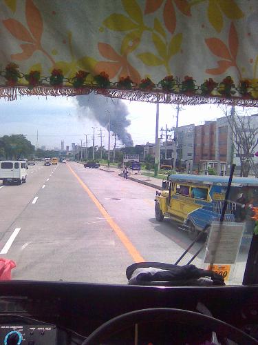 The jeep from my view in the bus - The jeepney in front of the bus.