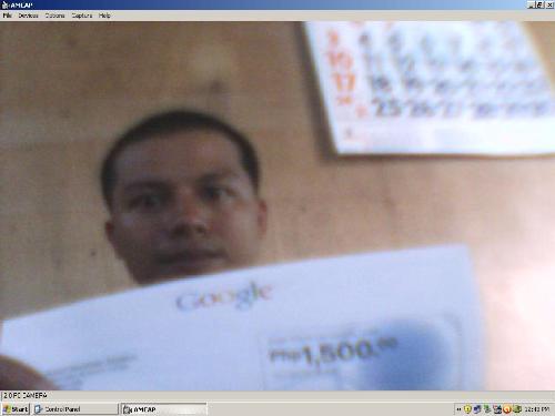 a friend who received free coupon from Google  - this is a picture of my friend who received a free coupons from google that allows him to advertise with google adwords