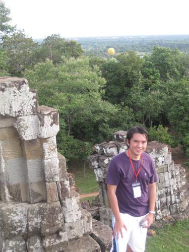 at Bakheng Hill - Got this taken at Bakheng Hill in Siem Reap Cambodia. This site is famous for those who want to watch a sunset. On top of a hill there is a temple in ruins where you can relax and enjoy the view. What a better way to end a day with a sunset in a temple ruin. Superb!!!
