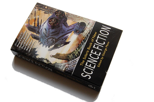 A book on Science Fiction - A book on science fiction, turned diagonally to the viewer. Large spacecraft on cover. 