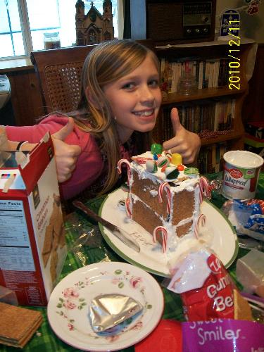 My Daughter's ginger bread house - My daughter working on her gingerbread house. December 2010.