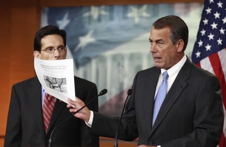 House Speaker John Boehner and House Majority Lead - House Speaker John Boehner of Ohio, right, accompanied by House Majority Leader Eric Cantor of Va., holds a copy of a proposal to repeal the Health Care Bill, Thursday, Jan. 6, 2011, during news conference on Capitol Hill in Washington. (AP Photo/Alex Brandon)