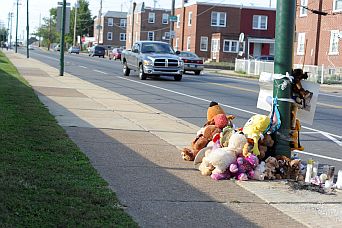 Memorial - teddy bears left for the mourning for someboy who lost his life due to gun violence.