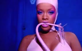 Rihanna in her song S & M - Rihanna in pink body hugging outfit in her video S & M wherein it suggests violence in relationships.