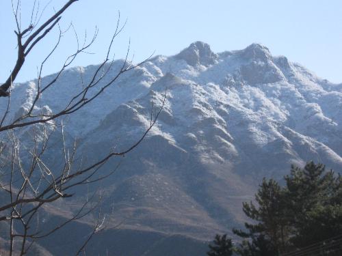The top of hill with snow - At the foot of the hill, there is a village of my wife. It snowed when last apirl, the hill became very beautifull with snow on the top.