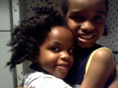 My sweeties. - My sweeties showing their brother and sister love to each other.