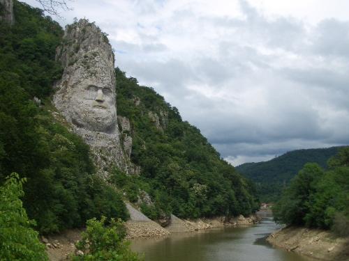 Dacian king Decebal - Carved into the rock face of millennial Dacian king Decebal strategist. It's Cazane,on the Danube, the river symbol of Romania, on a slope with other rustling forests that characterize the Carpathian area. It's our unique and meaningful. The expression of Romanians in these parts. And it's over, and sightseeing in an area of rare natural beauty.