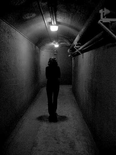 Life is a way to the unknown. Are you afraid? - A person walking through the dark