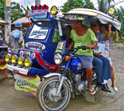 tricycle - public transportation, motorcycle with side cabin for passengers.