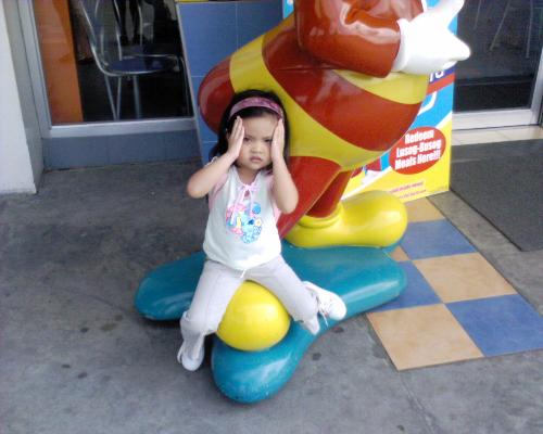 My daughter outside the mall - This picture was taken during our sightseeing at the mall. My daughter was posing and she's very cute.