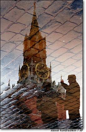 Best photo4 - Red Square reflection The Kremlin's Spassky Tower and passers-by are reflected in the wet cobblestones of Moscow's Red Square on Feb. 13.