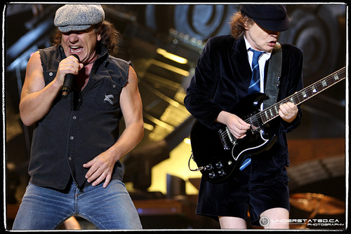 ac/dc - this is the pic of AC/DC performing live.. the lead singer and the lead guitarist are in the pic... they are amazing.. love the songs they make.. amazing band..