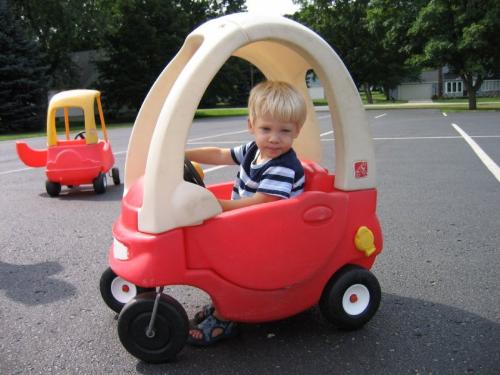 kiddy in a car - An image of a kiddy in a car for this category