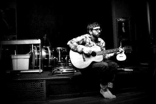 Dallas Green - Dallas Green playing the guitar.