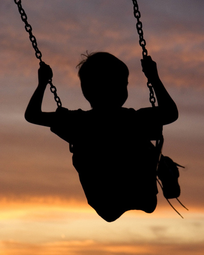 Swinging into the Sunset - I love backlit images like this were the people in the foreground are obscured.