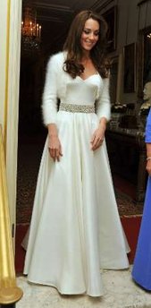 Duchess of Cambridge - The new duchess the night of her wedding in a very elegent strapless white gown with a short sweater to a dinner for the couple.