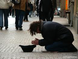tramp - begging in the street.