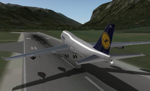 B747 Liftoff - A Boeing 747 leaving the ground in X-Plane 9. Flaps can be seen on the trailing edge of the wings.
