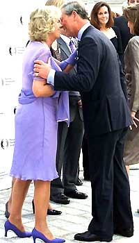 A kiss - Here is a photo of Prince Charles kissing his wife camilla,Duchess of Cornwell,in public.