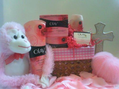 I create giftbaskets and gifts - This photo that you see is one of the giftbaskets that I created. It was for mothers day. Its theme is pink and it s called ' Olay for mothers day'. It's filled with olay products. I can create all types of giftbaskets so to=une in to more pictures and you can also visit my website at www.onegifttogive.devhub.com. You will also see an email address there and business number. Perfect for placing orders . Thanks for your support.
