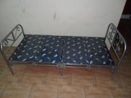 Folding bed - beds have nylon sheets in the middle held by springs on it sides that is attached to steel bars that folds in the middle for easy storage