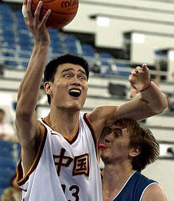 Yao Ming - Check the guy out trying to block Yao! His tongue is sticking out and licked Yao's armpit! it is gross and funny!